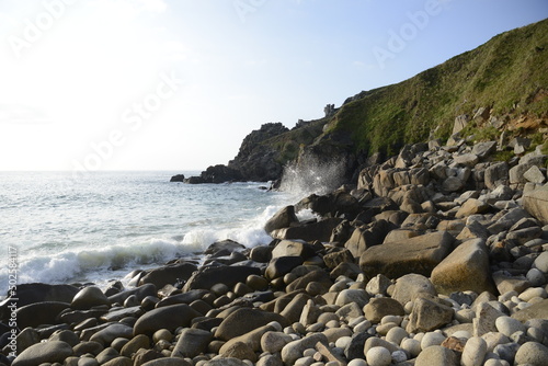 waves splashing on rocky beach and coast