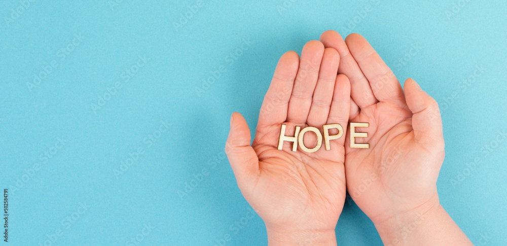 Holding the word hope in the palm of the hands, trust and believe concept, having faith in the future, hopeful positive mindset
Holding the word hope in the palm of the hands, trust and believe concept, having faith in the future, hopeful positive mindset
