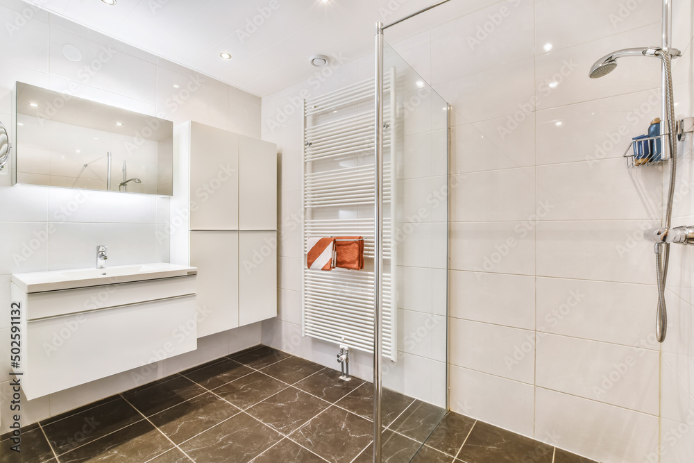 Interior of bathroom with shower and sink Interior of bathroom with shower and sink