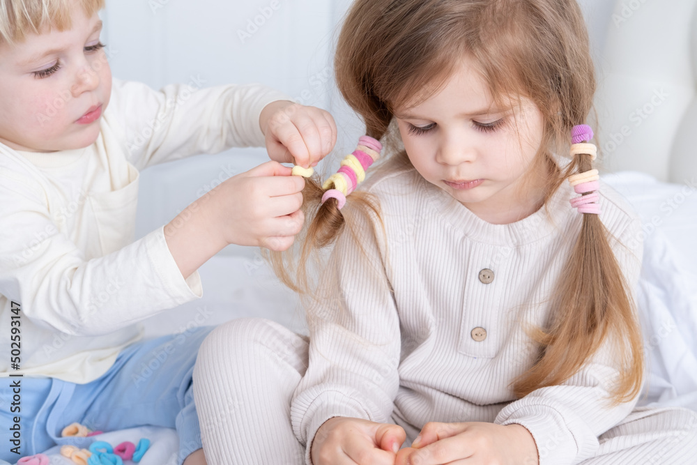 cute kid boy braids pigtails using colorful elastic bands for hair for little girl sister cute kid boy braids pigtails using colorful elastic bands for hair for little girl sister