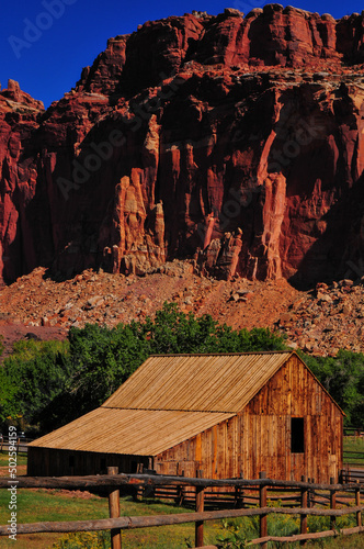 An old barn against the sandstone walls around Fruita, Capitol Reef National Park, Utah, Southwest USA photo