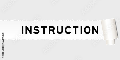 Ripped gray paper background that have word instruction under torn part