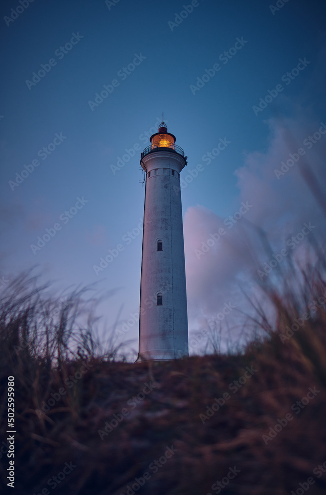 Lighthouse in the early morning hours in summer. High quality photo
