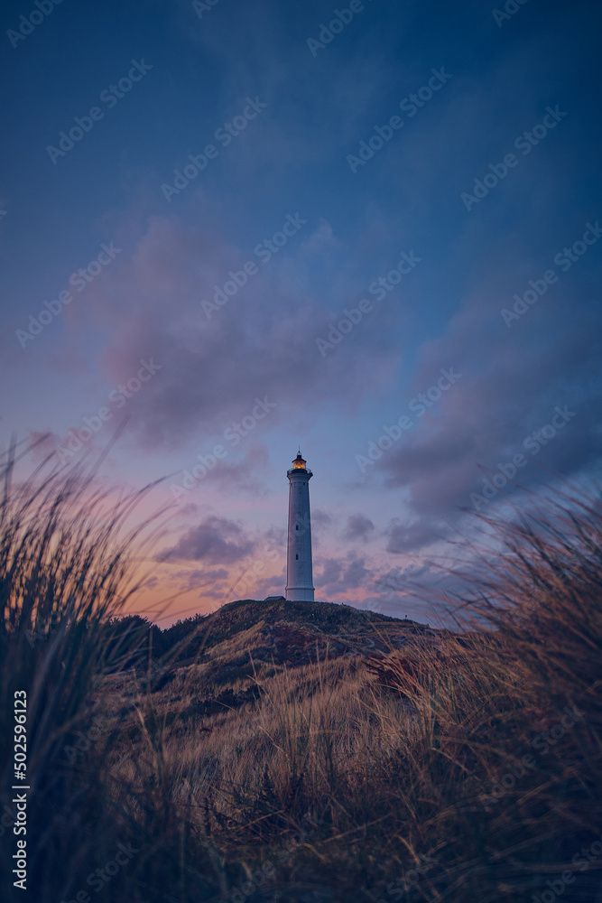 Famous lighthouse lyngvig fyr at the danish coast bevfore sunrise. High quality photo