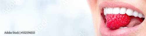 Photos Banner perfect white smile close up, female crown veneer toothy smile with big red raspberry, dental care and stomatology copyspace
