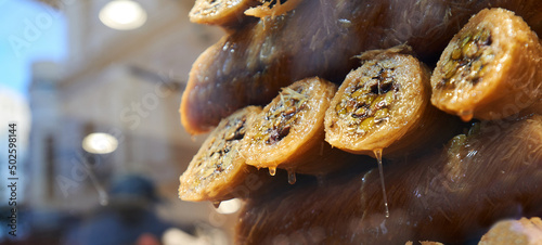 Fototapeta Naklejka Na Ścianę i Meble -  wallnut, pistachio turkish style antep baklava banner presentation. Traditional turkish delight dessert. Havuc dilimi.