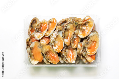 Fresh baby clams in box isolated on white background. Ready to cook for delicious seafood menu.