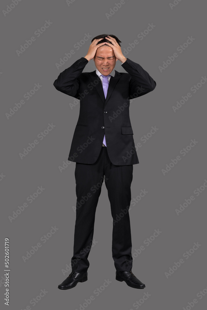 Stressed businessman with headache at work Stressed businessman with headache at work