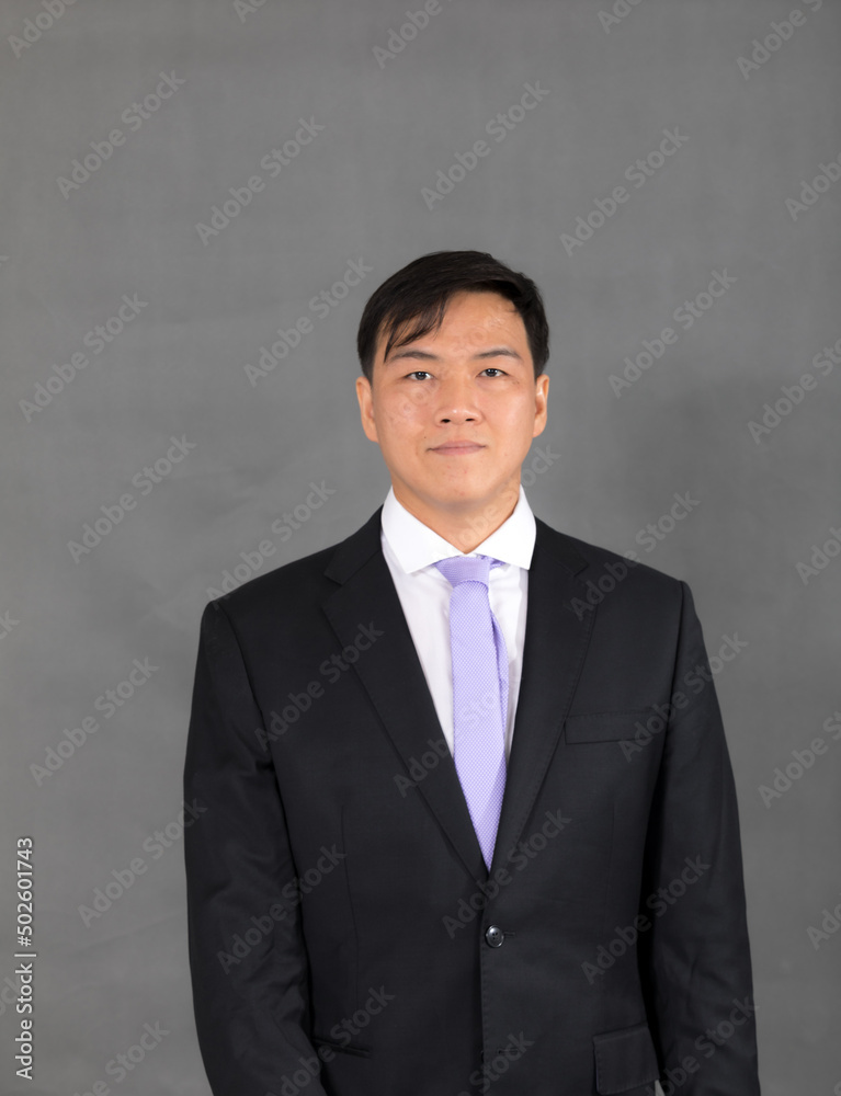 Portrait of attractive businessman Asian standing against on gray background with copy space and clipping path Portrait of attractive businessman Asian standing against on gray background with copy space and clipping path