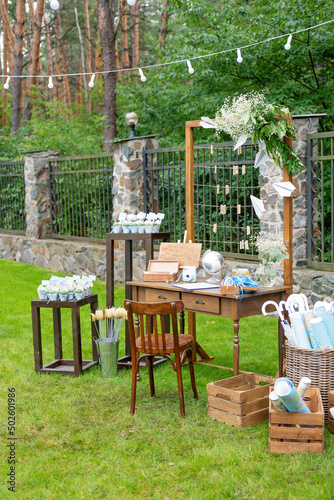 Wedding photo zone with travel decorations. Globe, airplane, world map. Soft selective focus.