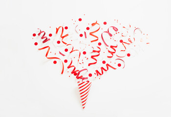 striped birthday hat with confetti on white background