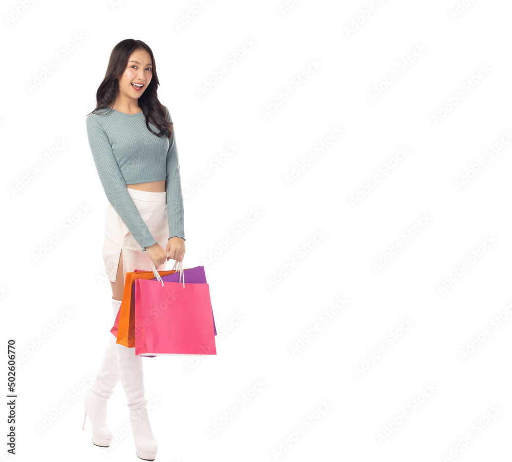 Shopping girl get happy holding shopping bags stand over isolated on white background Copy space Beauty young asian woman love shopping Full length body size photo girl smiling Female look at camera Shopping girl get happy holding shopping bags stand over isolated on white background Copy space Beauty young asian woman love shopping Full length body size photo girl smiling Female look at camera