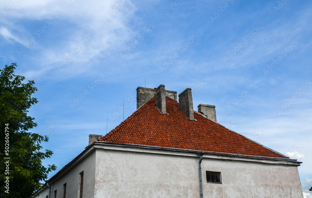 Tiled roof of two storeys palace of Prince Stanislaw Lubomirski located at territory of Dubno Castle. Rivne region, Western Ukraine