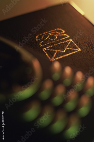 Close-up of a telephone and address book