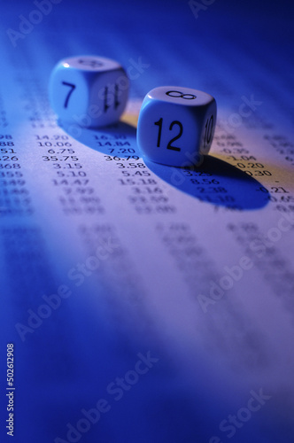 Pair of numbered dice on stock listings