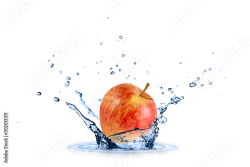 Fresh red yellow apple flying falling in splashing water isolated on white
