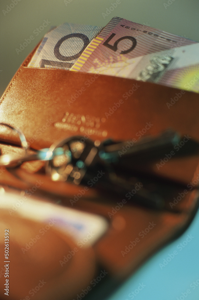 Australian banknotes in a wallet with keys Australian banknotes in a wallet with keys