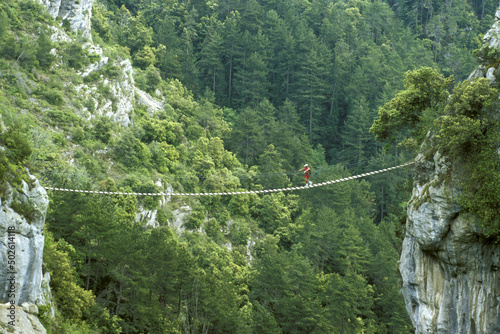 Person crossing a footbridge, France