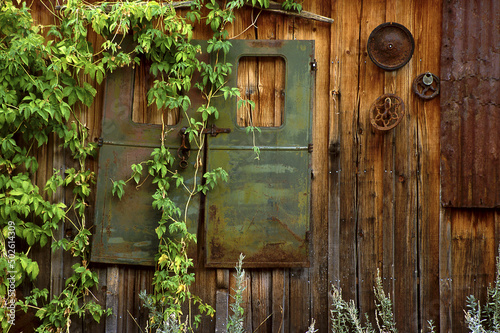 Metal artifacts hanging on a wooden wall, Silver City, Idaho, USA