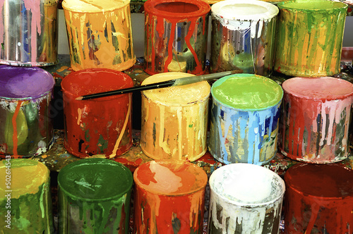 Close-up of large group of paint cans