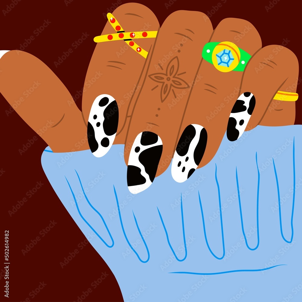 Female hand with manicured nails, golden rings and jewelry. Close up