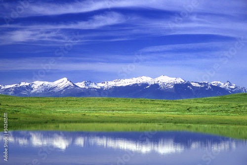 Reflection of snowcapped mountain in water, Wallowa Mountains, Oregon, USA photo