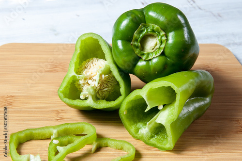 green bell peppers on wooden table