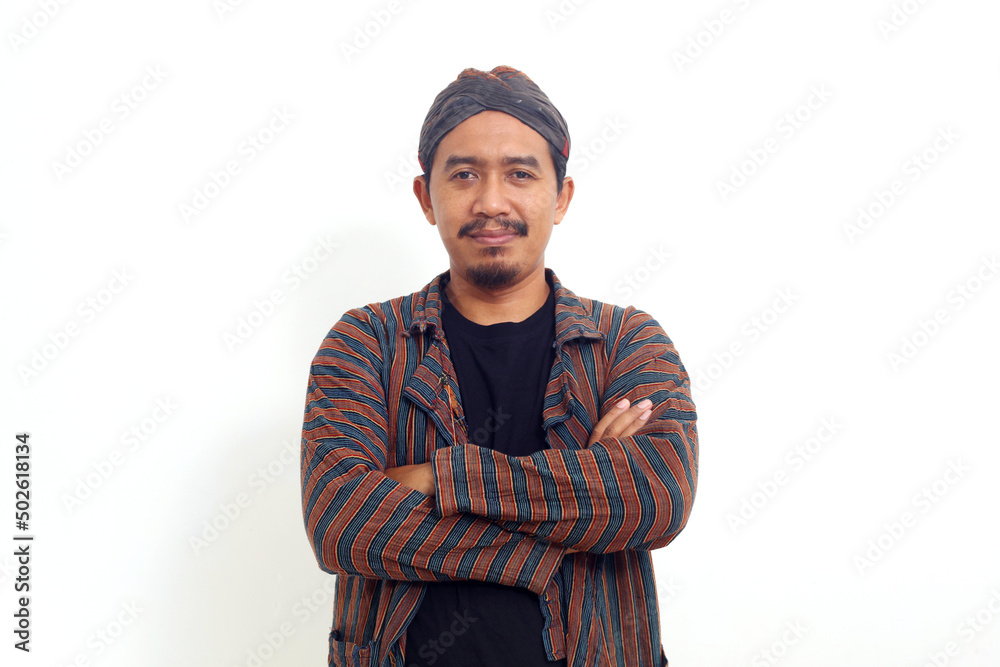 Smiling asian man standing while folding his hand. Isolated on white background Smiling asian man standing while folding his hand. Isolated on white background
