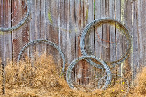 USA, Washington, Silverdale, Historic Petersen Farm, Wire coiled on wall