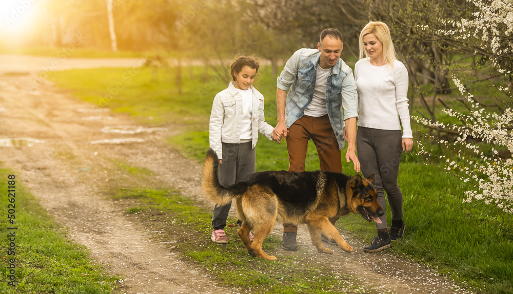 family with a German shepherd dog family with a German shepherd dog