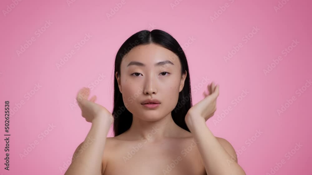 Self love and care. Mirror pov portrait of young beautiful asian woman preening, fixing hair, enjoying her appearance Self love and care. Mirror pov portrait of young beautiful asian woman preening, fixing hair, enjoying her appearance