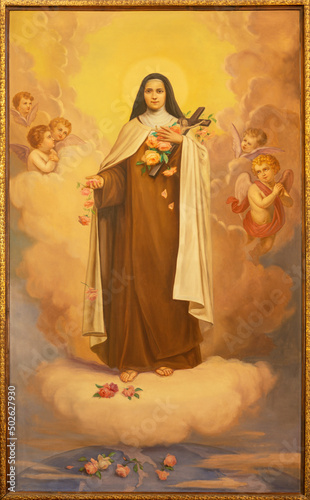 MONOPOLI, ITALY - MARCH 6, 2022: The painting of St. Therese of Avila in the church Chiesa di San Franceso d Assisi by A. Nicolas (1931). photo