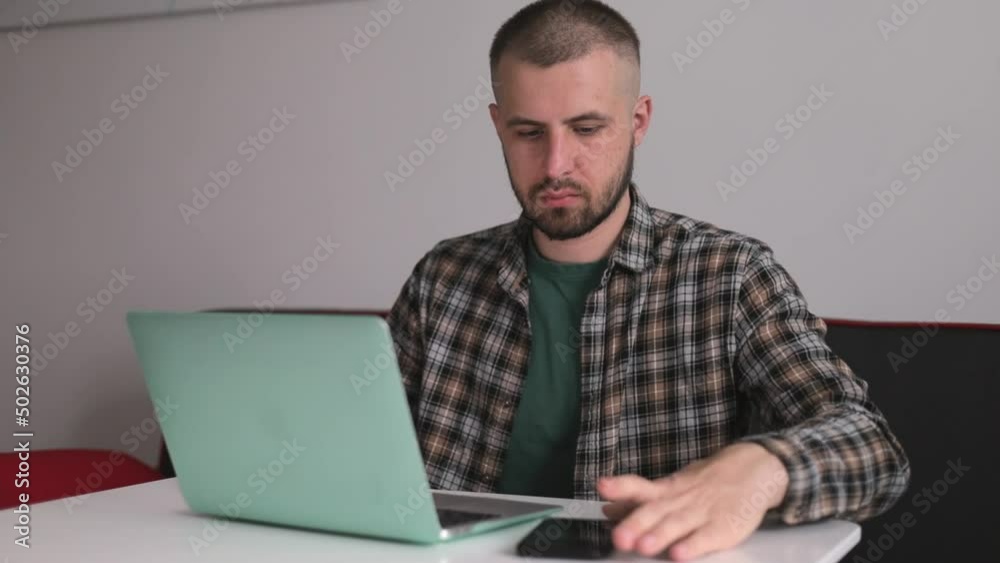 The guy received a message, works remotely. Freelancer. The guy received a message, works remotely. Freelancer.
