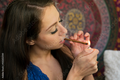 Young Brunette Model Smoking Marijuana