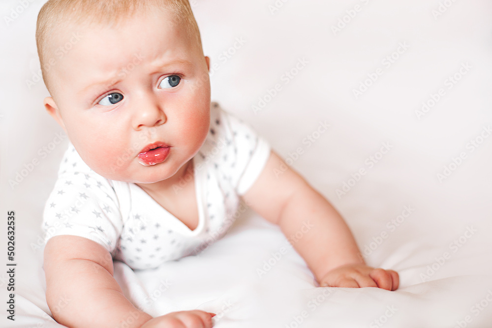 Cute baby reaction. Emotional baby. Pretty infant closeup