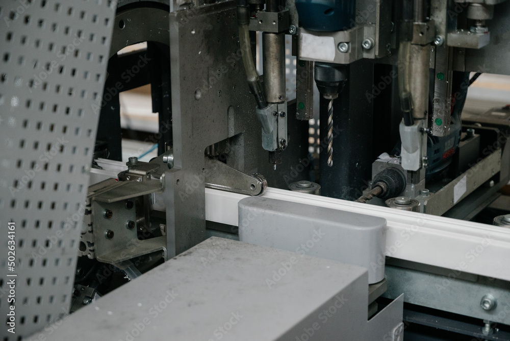 Factory for aluminum and PVC windows and doors production. Details industrial equipment. Factory for aluminum and PVC windows and doors production. Details industrial equipment.