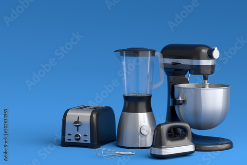Electric blender for making healthy smoothie  hand mixer and toaster on blue