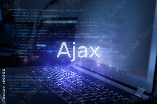 Ajax inscription against laptop and code background. Technology concept.
