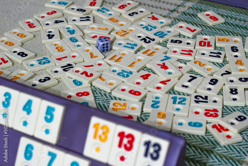 messy rummikub game white tiles on the table, as known as okey in Turkey