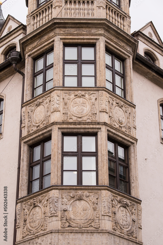 Munich, Germany - May 01, 2022: Old Decorative Wooden window. Munich, Germany - May 01, 2022: Old Decorative Wooden window.