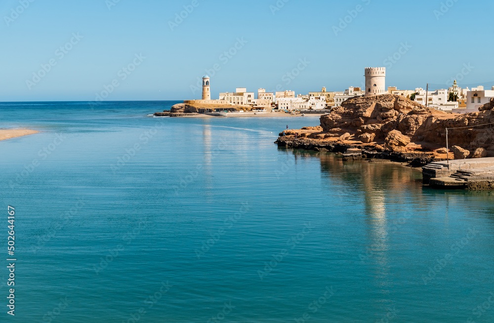 Landscape of the bay of Sur with Al Ayjah Lighthouse and fort on the rock, Sultanate of Oman in the Middle East. Landscape of the bay of Sur with Al Ayjah Lighthouse and fort on the rock, Sultanate of Oman in the Middle East.