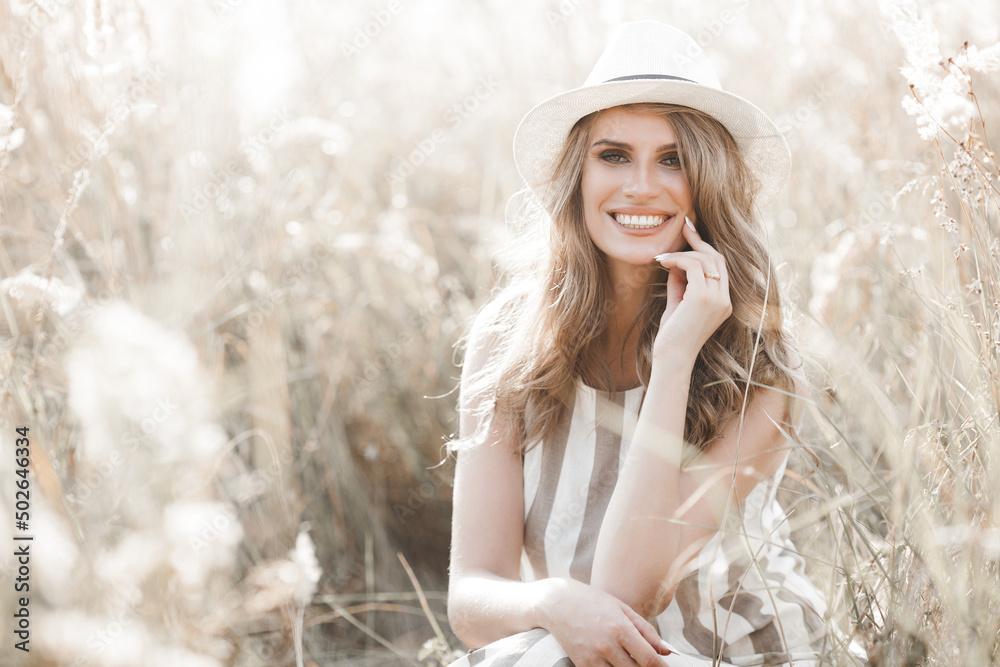 Young attractive woman in the hat. Closeup portrait of beautiful woman outdoors. Pretty lady smiling Young attractive woman in the hat. Closeup portrait of beautiful woman outdoors. Pretty lady smiling