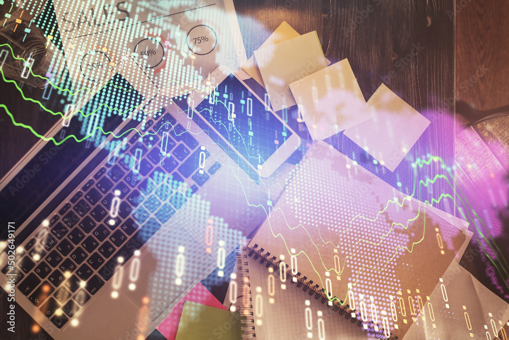 Financial market graph and top view computer on the desktop background. Multi exposure. Investment concept. Financial market graph and top view computer on the desktop background. Multi exposure. Investment concept.