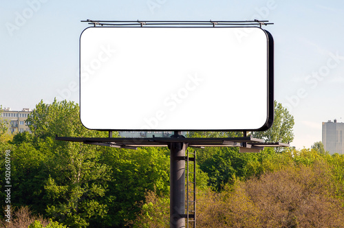 Blank white billboard for advertisement near city park