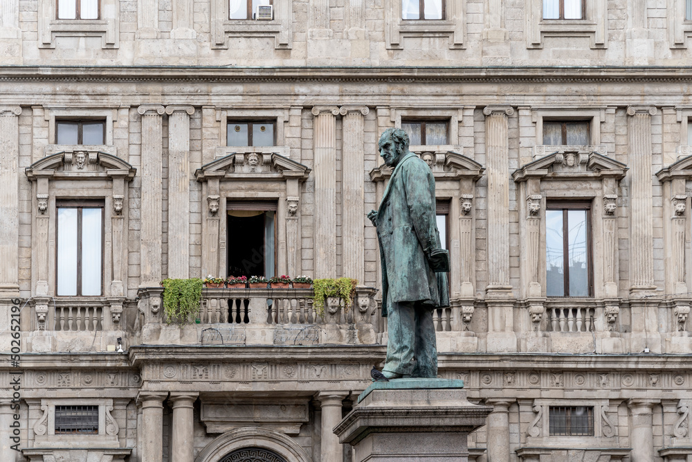 Bronze statue of Italian writer Alessandro Manzoni in San Fedele square, in front of the homonym church, in Milan city center, Lombardy region, Italy