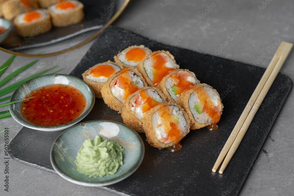 Hot tempura sushi on a gray dish close-up Hot tempura sushi on a gray dish close-up