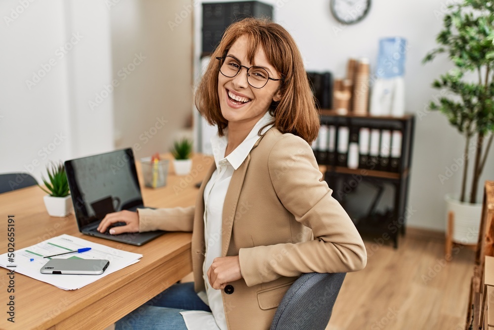 Young caucasian businesswoman smiling happy working at the office. Young caucasian businesswoman smiling happy working at the office.