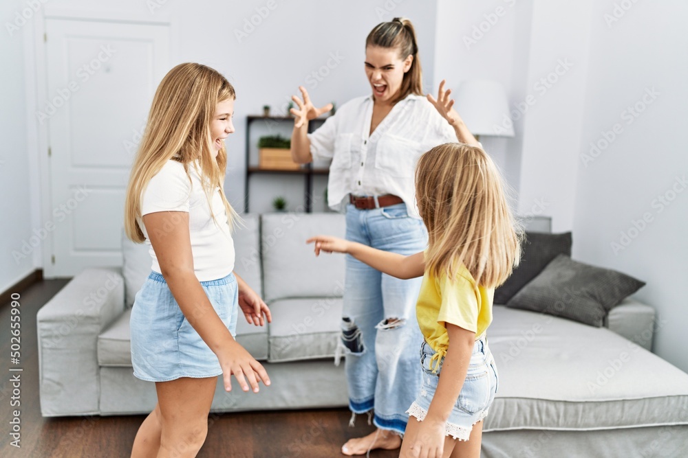 Fototapeta premium Mother and daughters angry for sisters problem at home