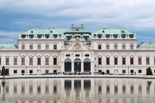 White Belvedere Palace in Vienna. The upper building of the Belvedere Museum with reflection in the water. Historical and tourist attractions in Austria