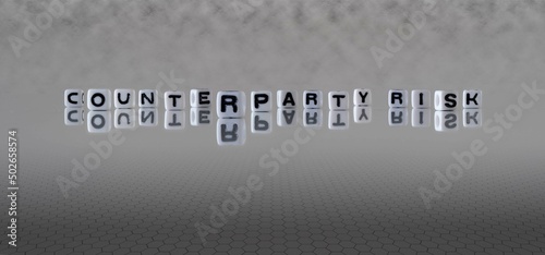 counterparty risk word or concept represented by black and white letter cubes on a grey horizon background stretching to infinity